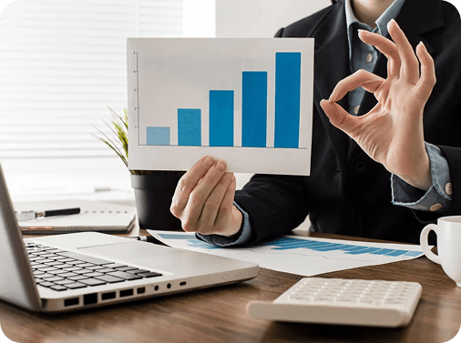 An adviser presenting loan growth figures on a chart